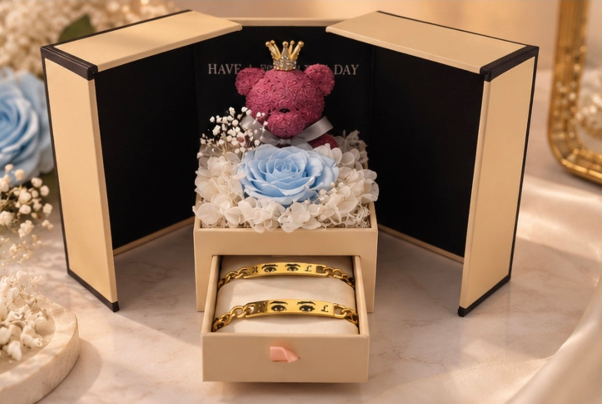 Blaue Rosenbox mit personalisierten Augen-Partnerarmbändern